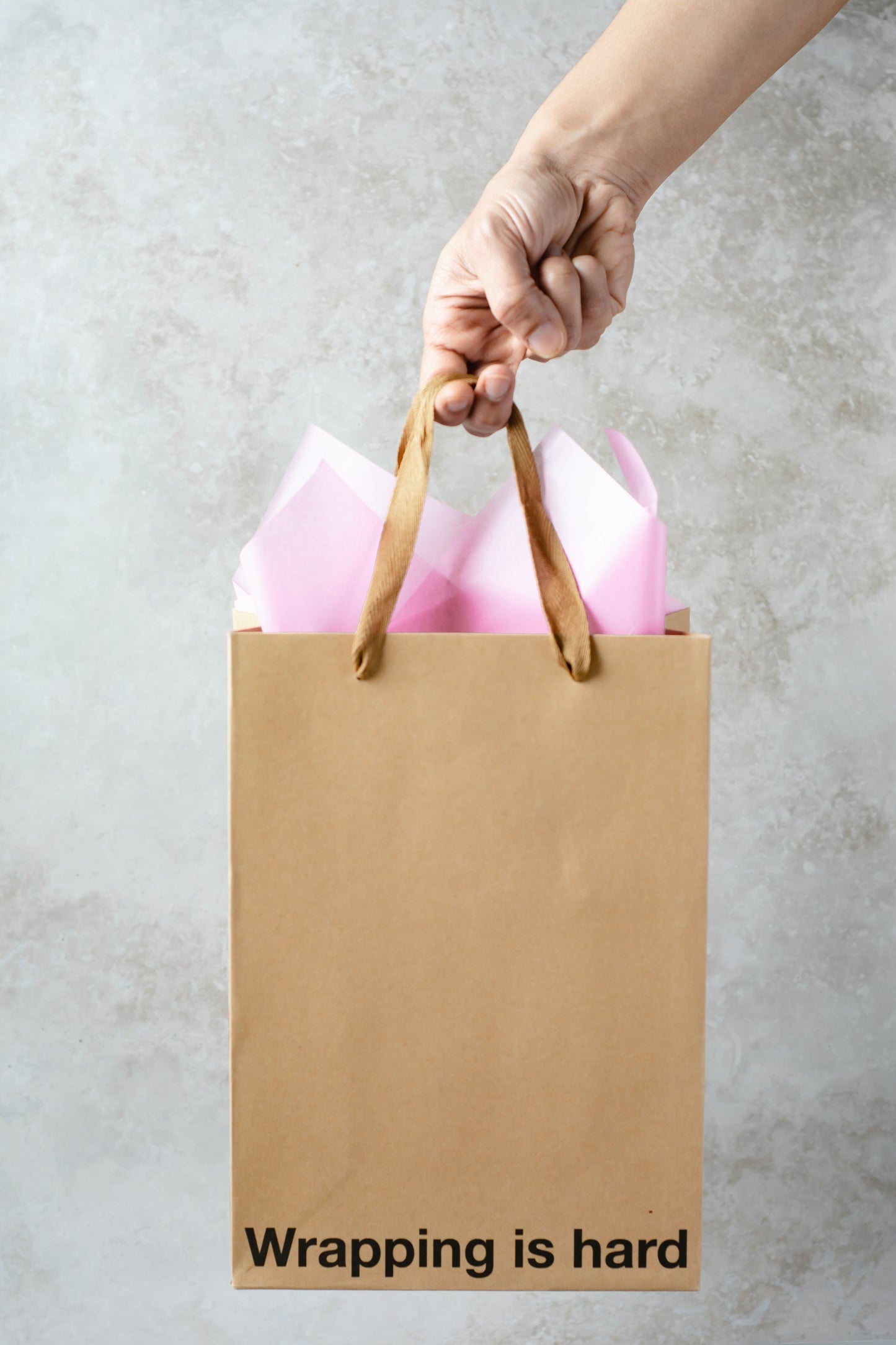 Kraft gift bag with brown ribbon handle, perfect for adult gift bags and unique gifts.