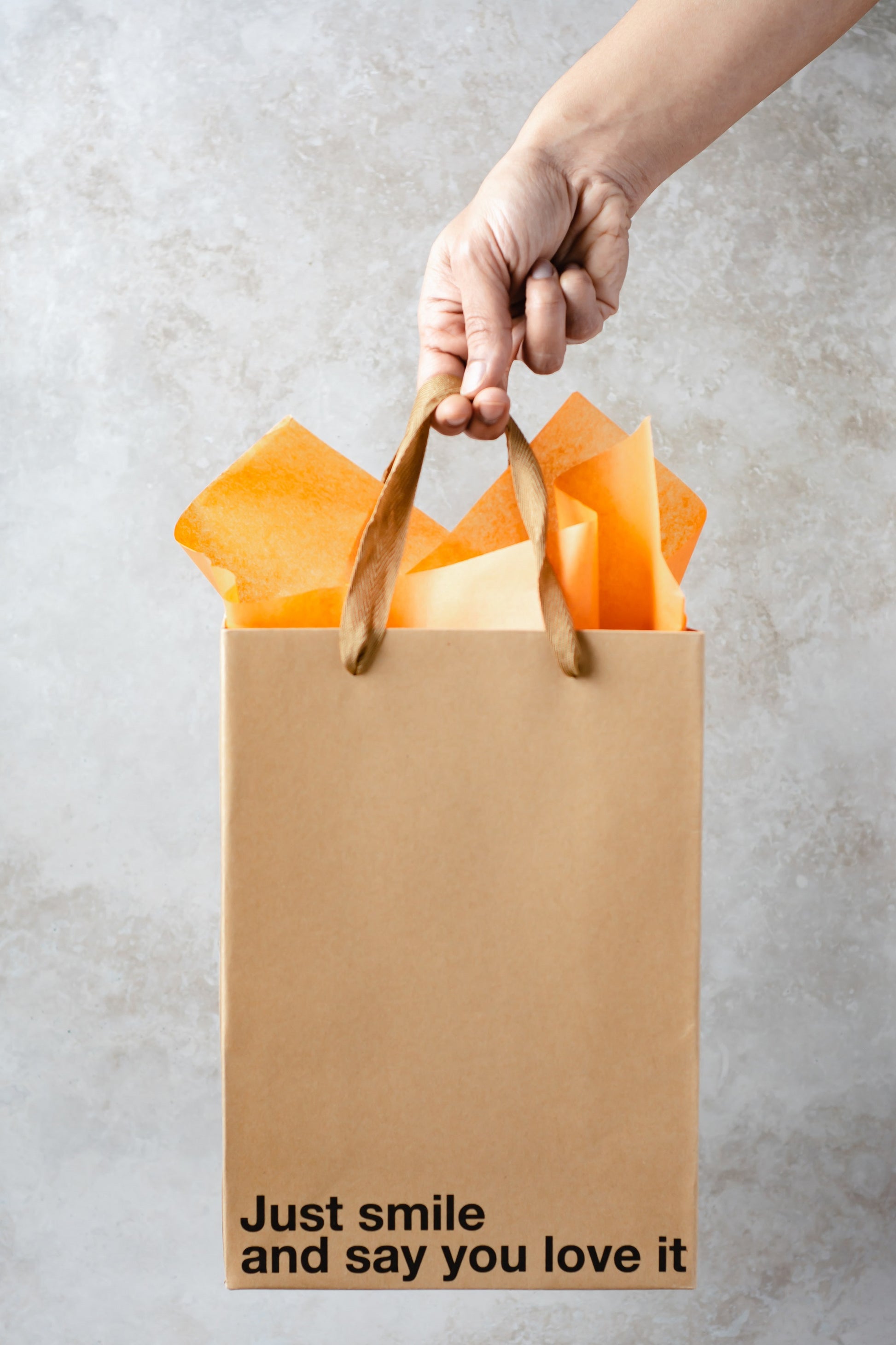 "Just Smile" kraft gift bag – Funny and unique adult gift bag with a brown ribbon.