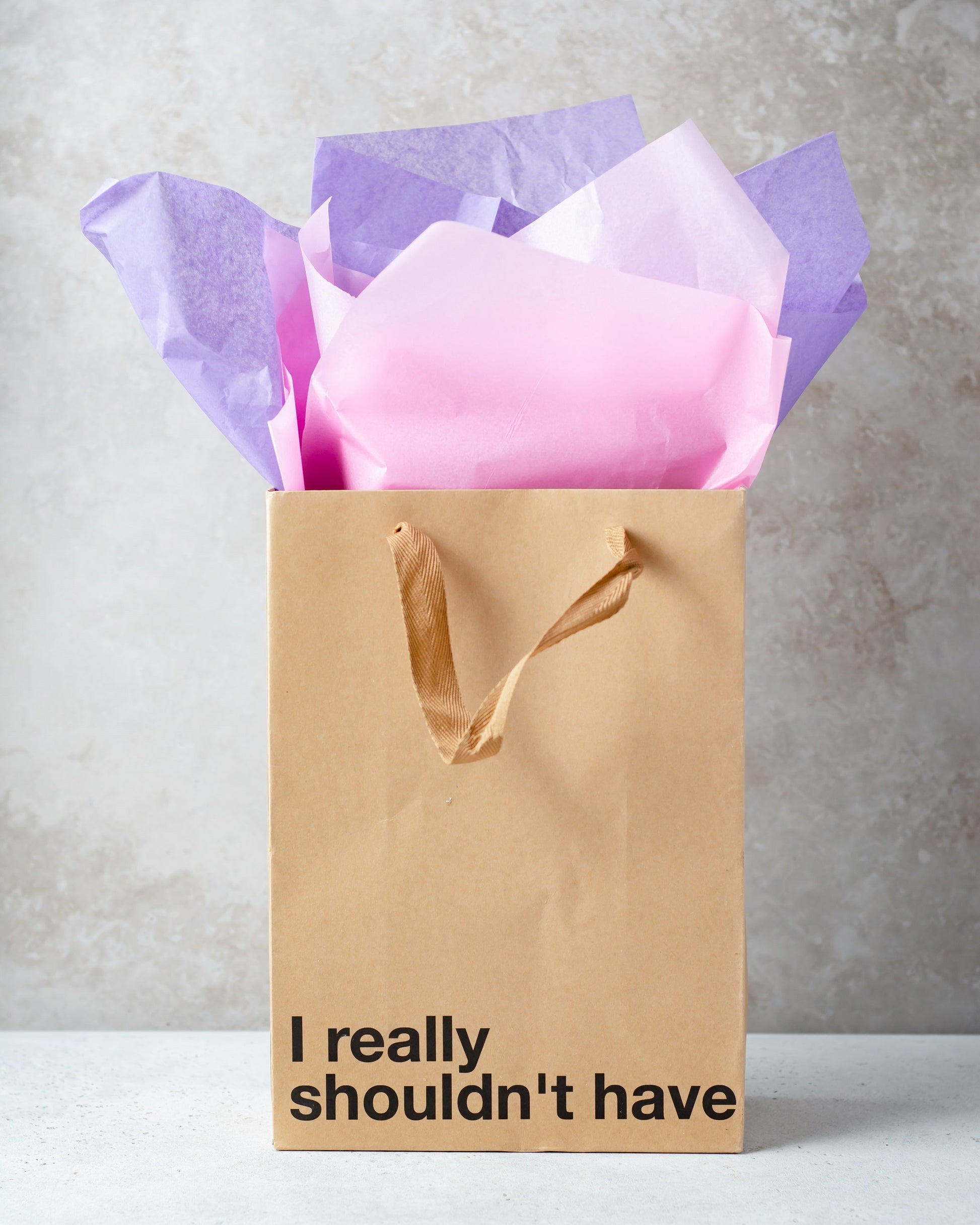 "I Really Shouldn't Have" kraft gift bag – Funny adult gift bag with a brown ribbon.