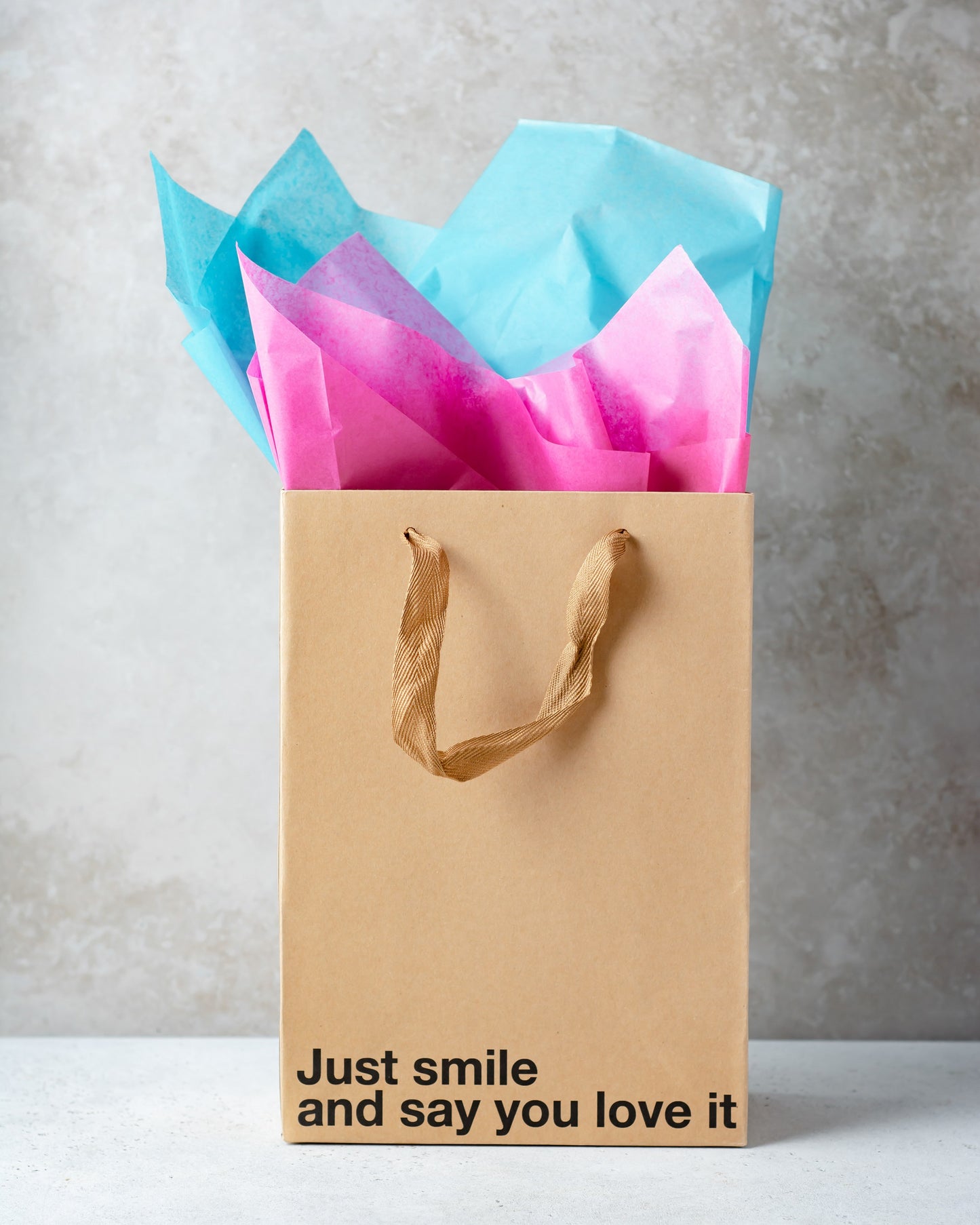 "Just Smile" kraft gift bag – Funny and unique adult gift bag with a brown ribbon.