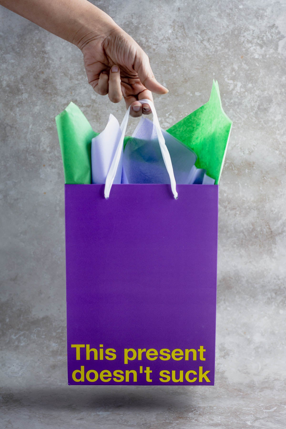 Purple kraft gift bag with funny design – ideal for adult gifts.