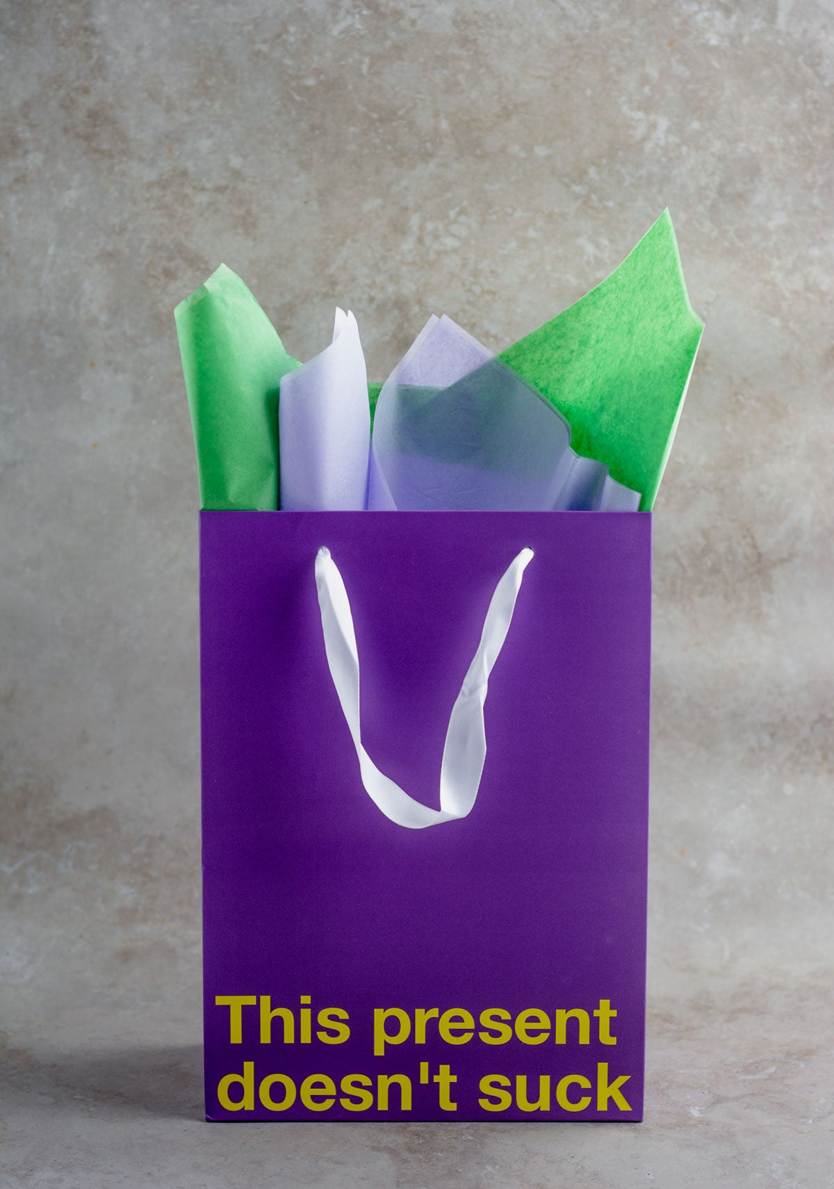 Purple kraft gift bag with funny design – ideal for adult gifts.