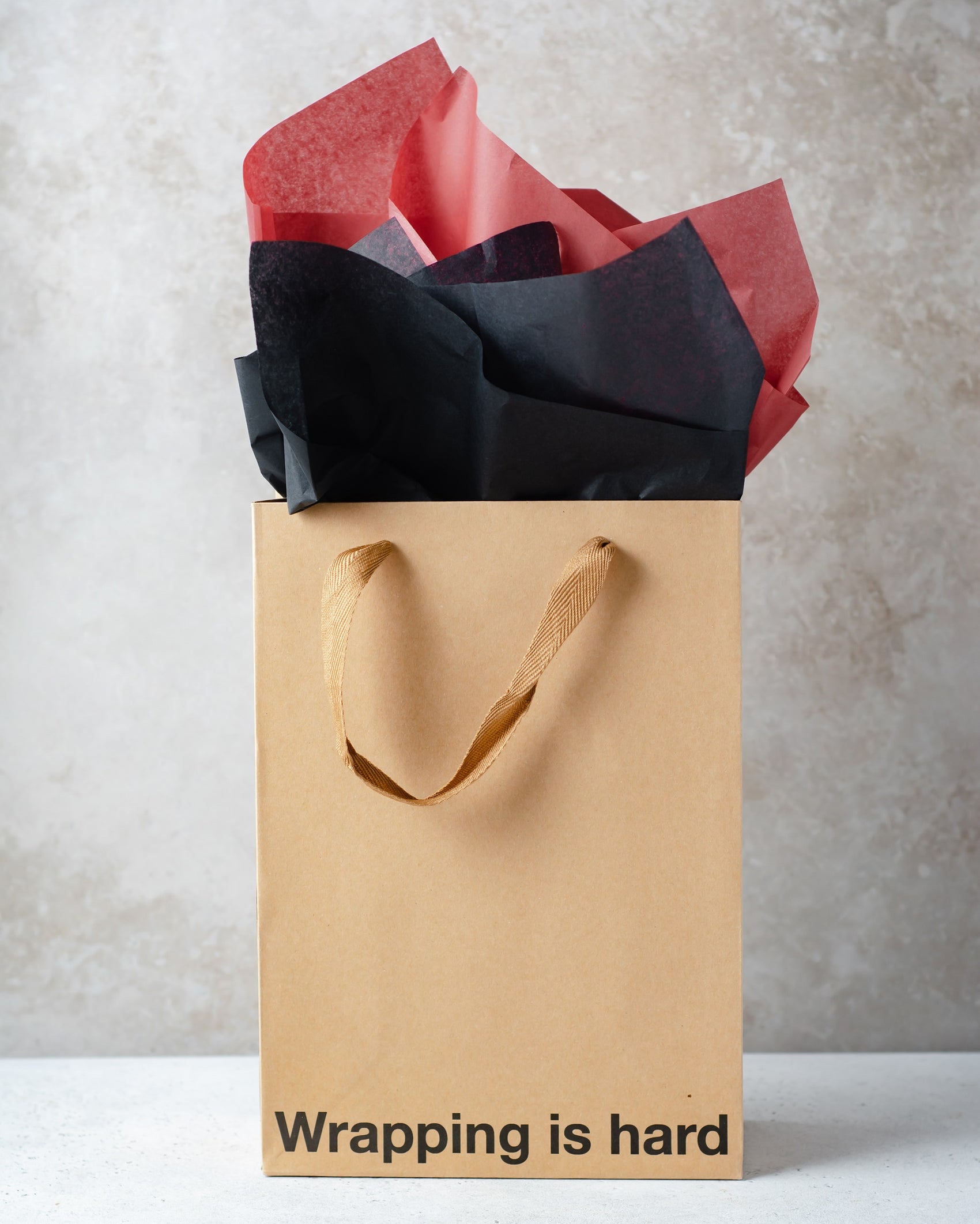 Kraft gift bag with brown ribbon handle, perfect for adult gift bags and unique gifts.
