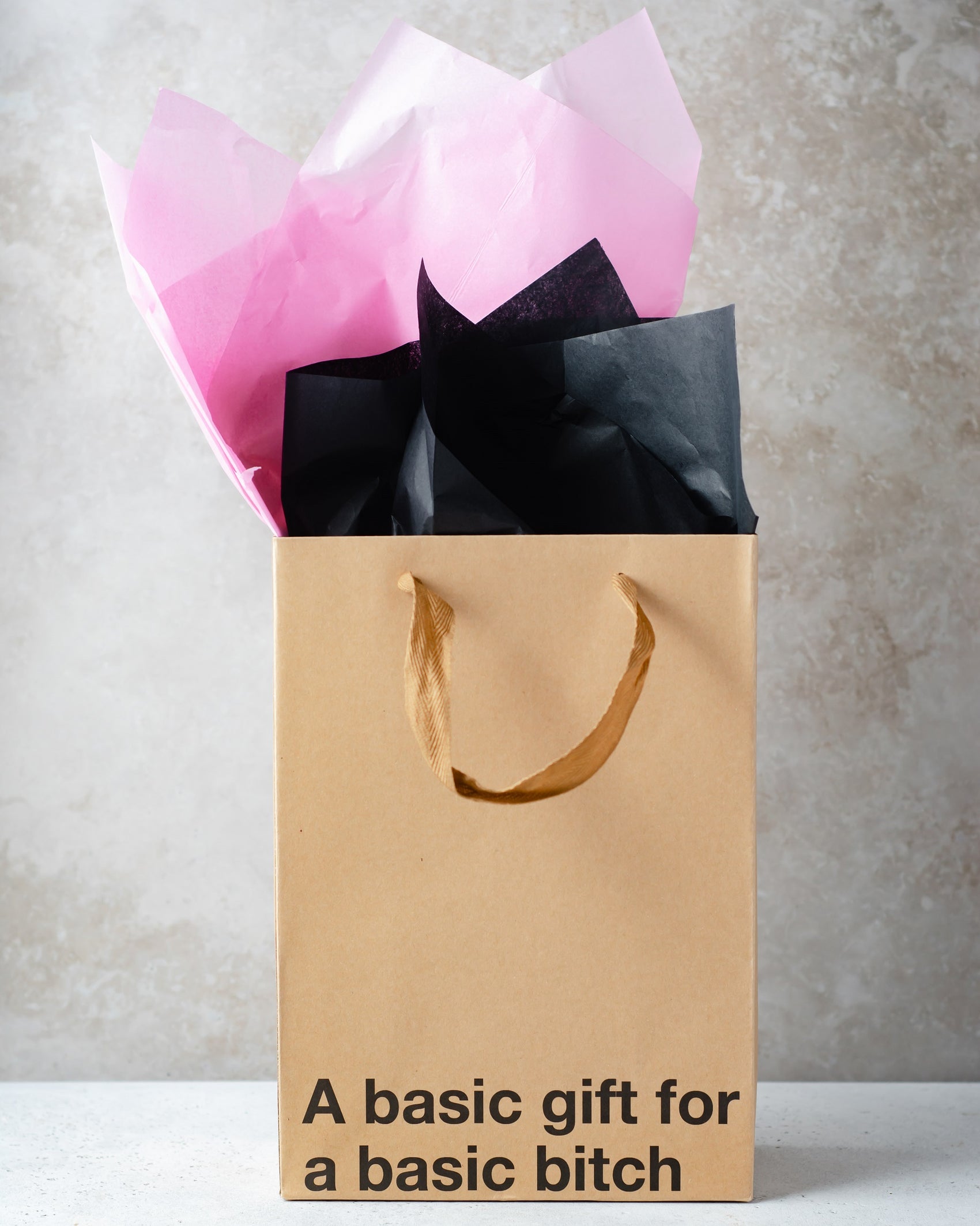 Funny kraft gift bag with brown ribbon handle.
