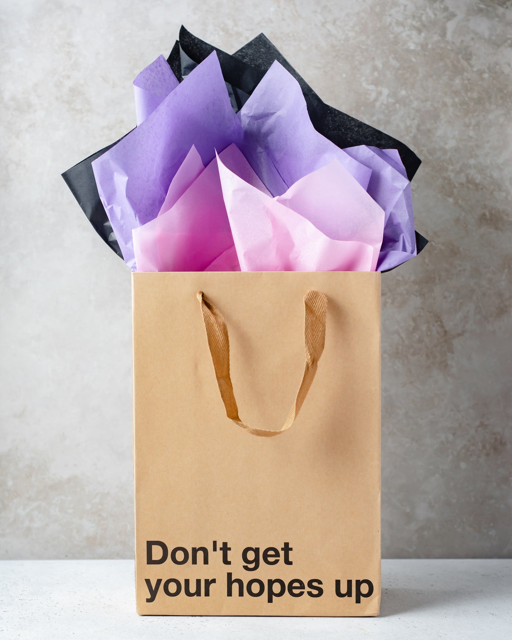 "Don't Get Your Hopes Up" gift bag – Funny, snarky kraft gift bag with brown ribbon.