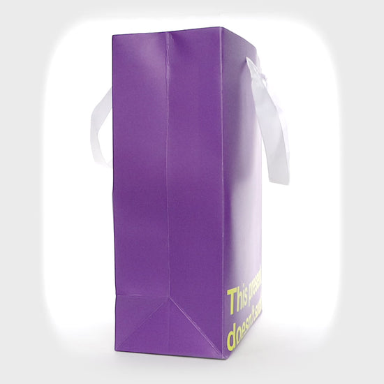 Purple kraft gift bag with funny design – ideal for adult gifts.