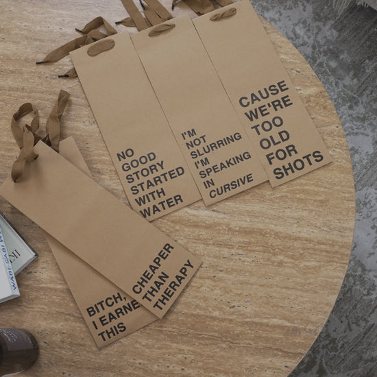 "I'm Not Slurring I'm Speaking in Cursive" wine gift bag – Funny and eco-friendly paper wine bag.