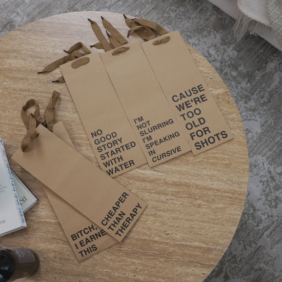 Wine gift bag set made of kraft paper, perfect for funny wine bags and gifting.