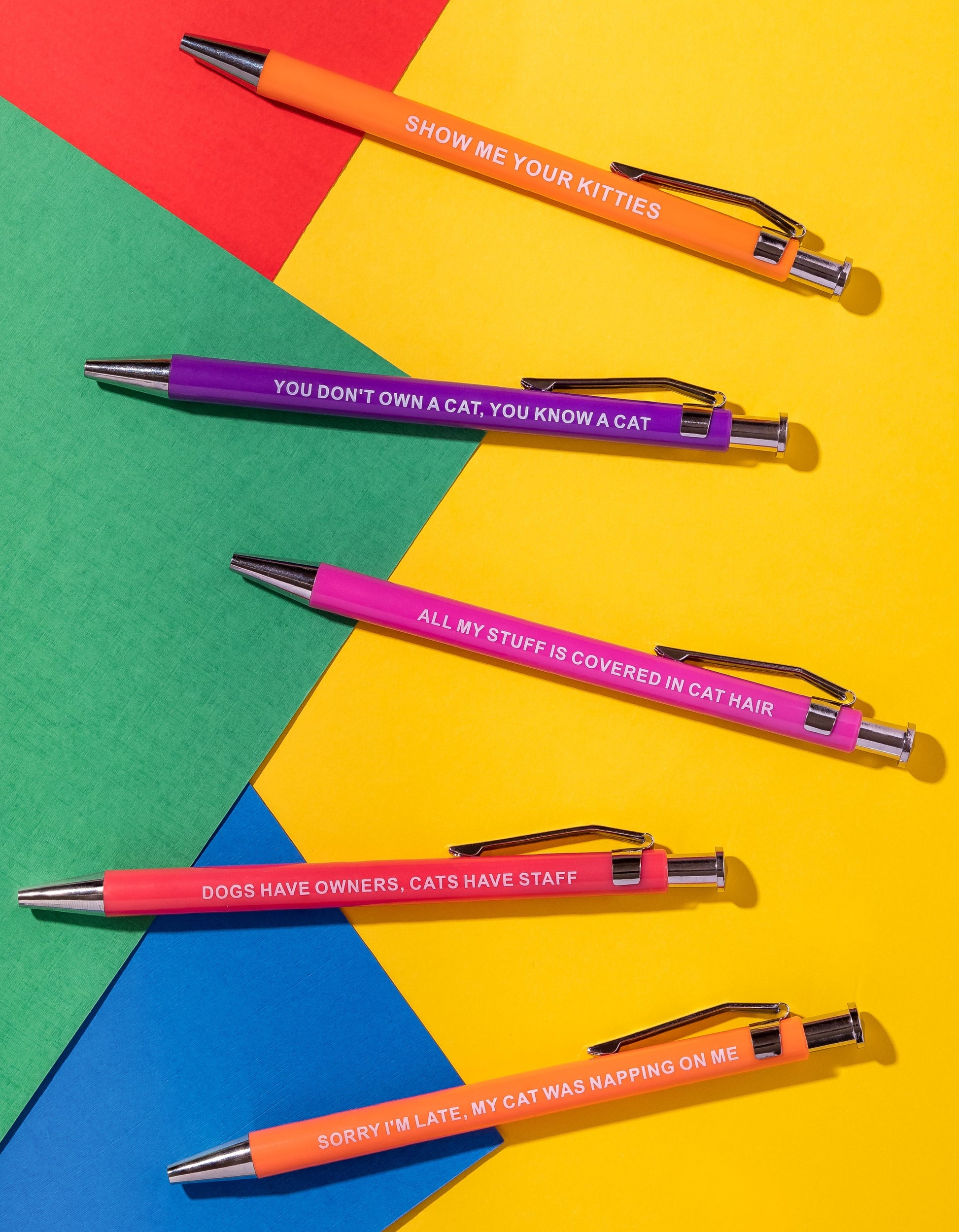 Sarcastic pens with cat-themed designs and witty phrases for cat lovers.