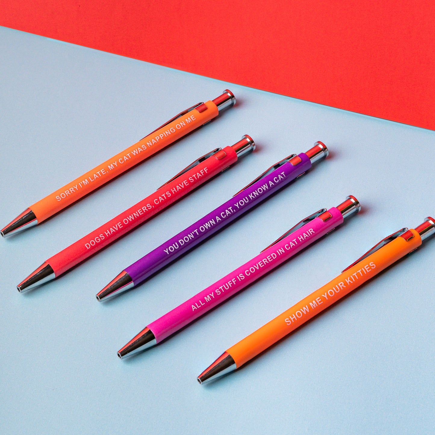 Sarcastic pens with cat-themed designs and witty phrases for cat lovers.