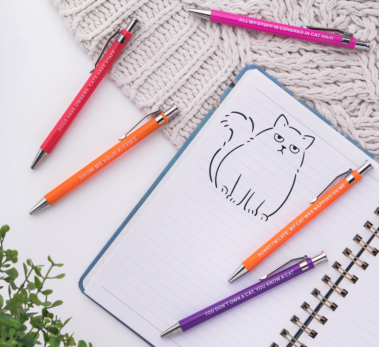 Sarcastic pens with cat-themed designs and witty phrases for cat lovers.